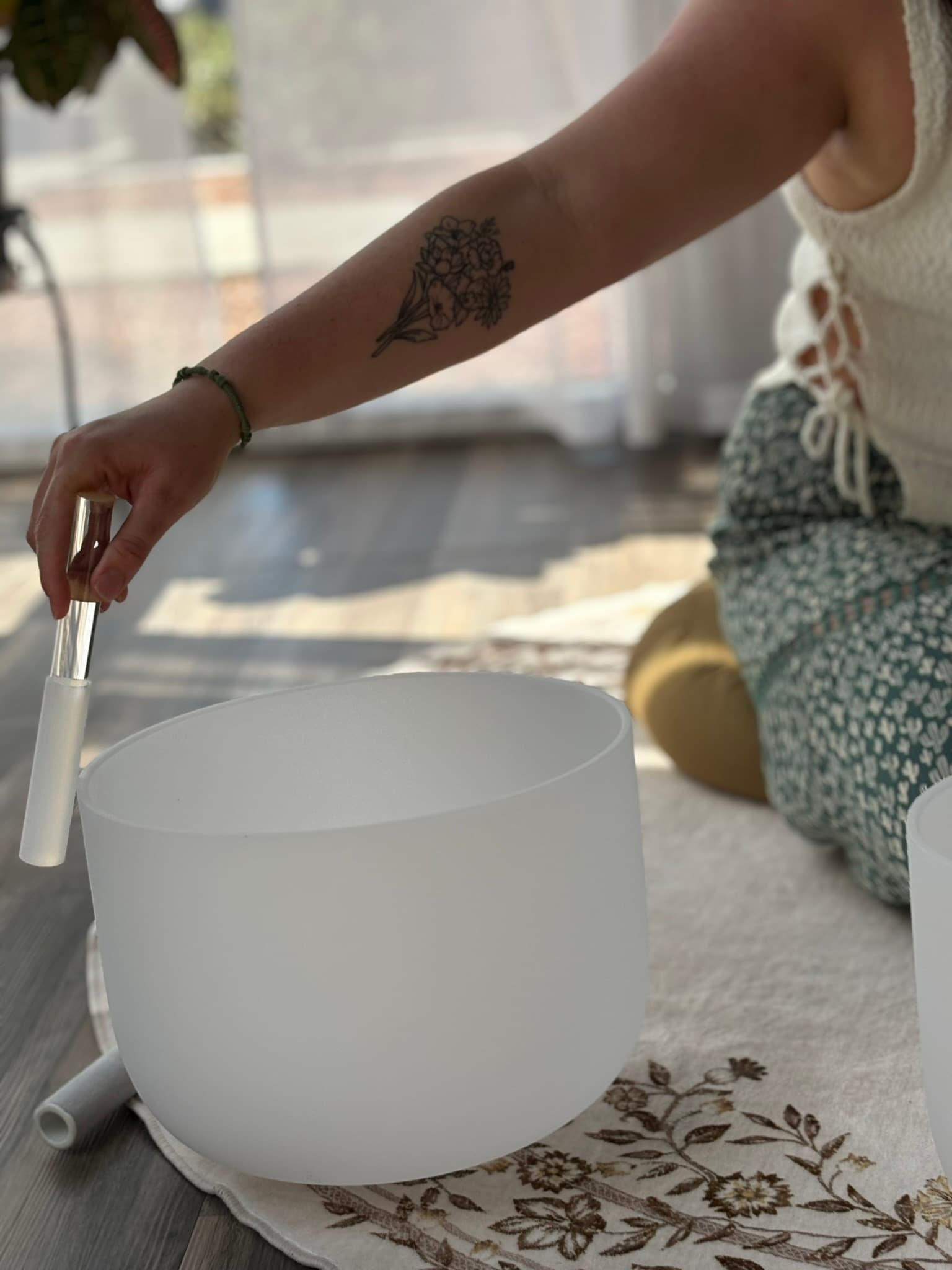 Jenn playing frosted crystal Chakra bowl