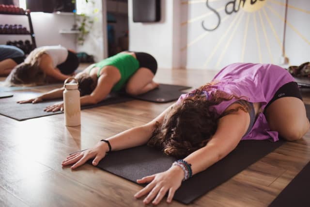 Jenn and class in Balasana or Childs Pose